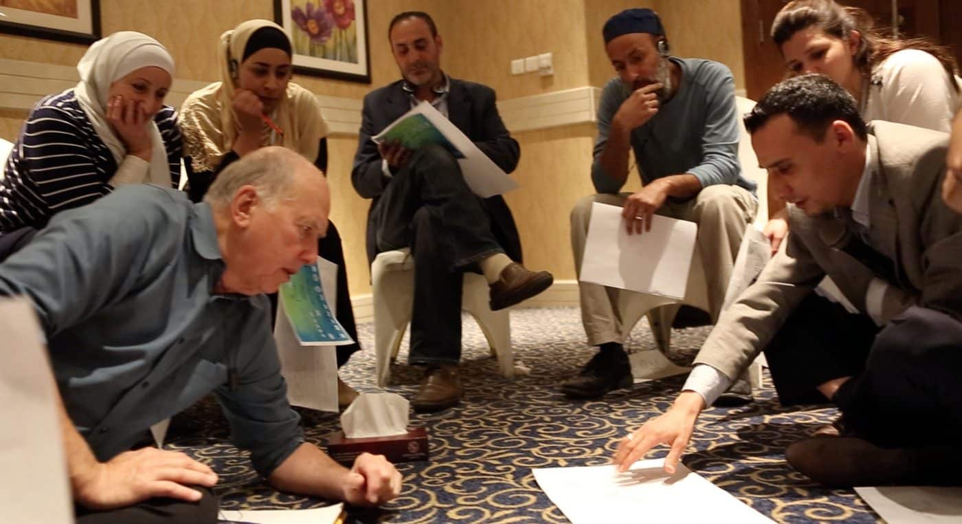 James Gordon, MD working with Syrian refugees on genograms