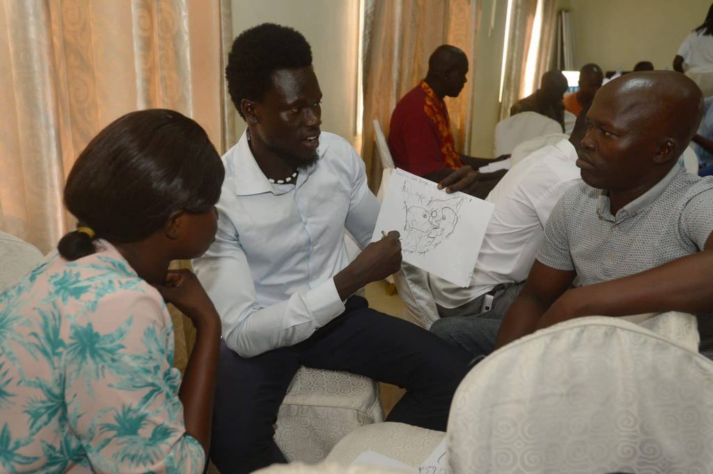 Participants in a Mind-Body Skills workshop sharing drawings