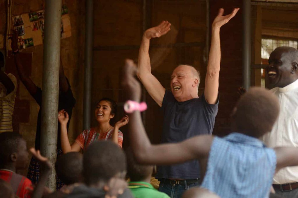 Musarrat Al-Azzeh and James Gordon, MD singing and dancing in Juba
