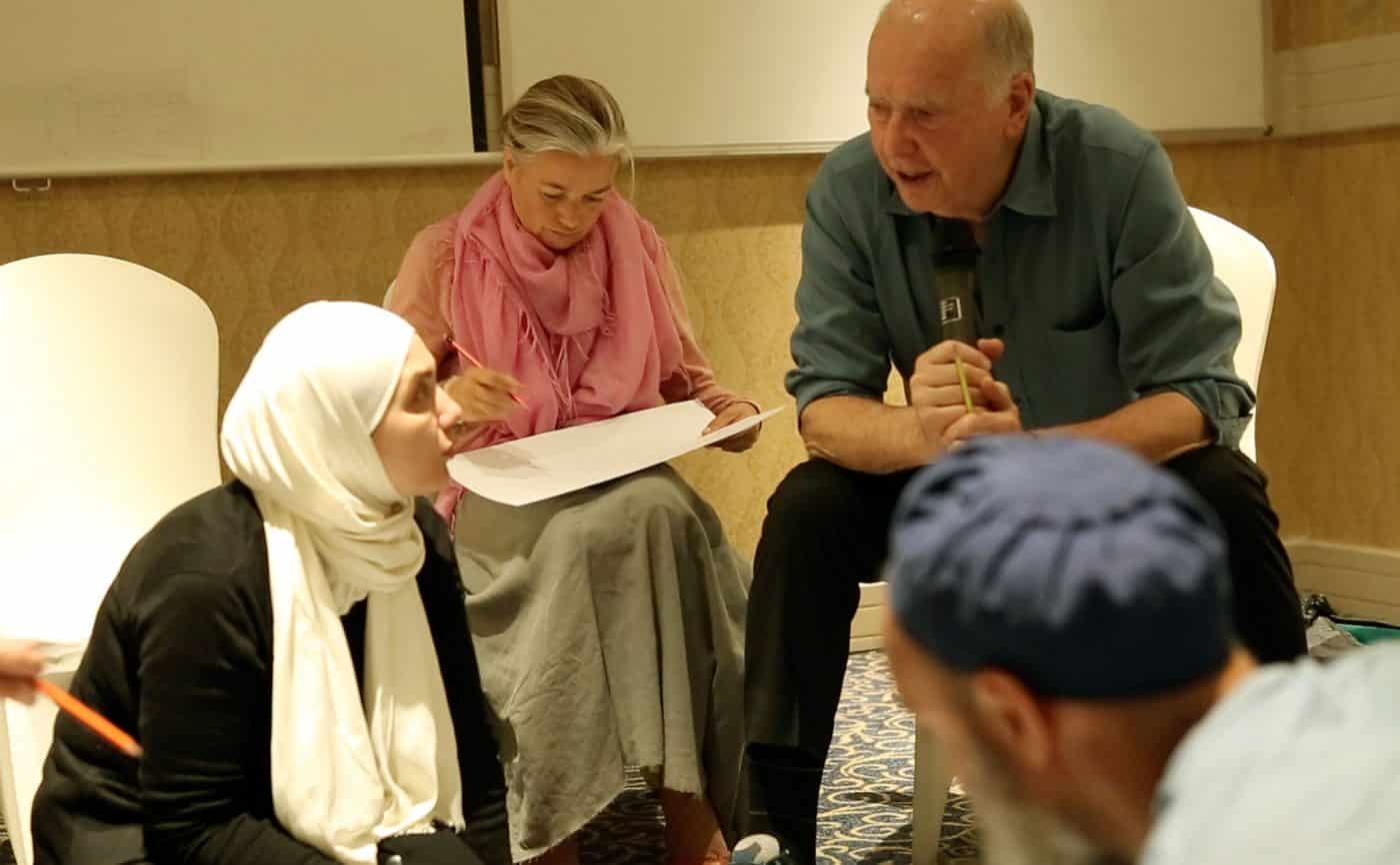 James Gordon, MD working with aid workers and Syrian refugee leaders in Jordan
