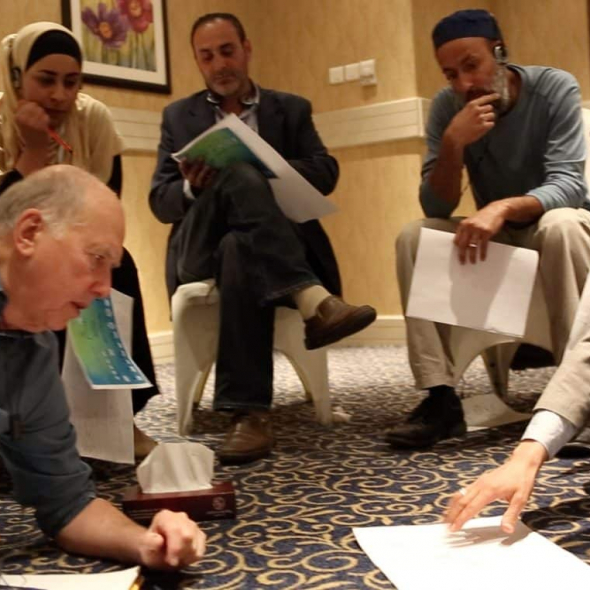James Gordon, MD working with Syrian refugees on genograms
