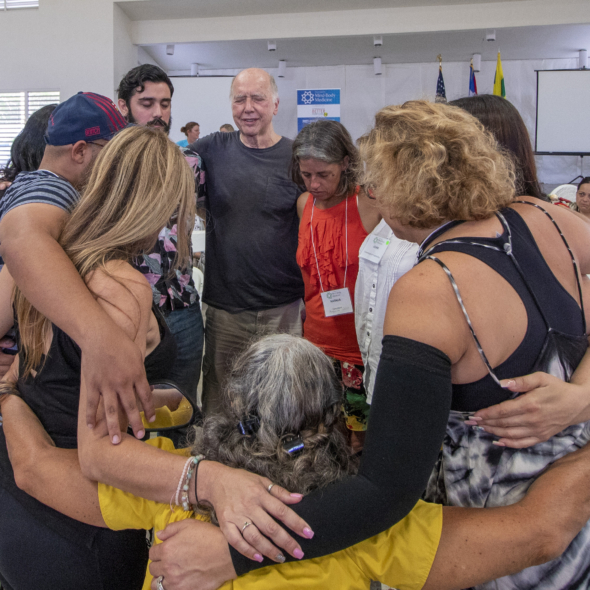 Faculty, Staff, and participants embrace on the last day of training in Puerto Rico, August 2019